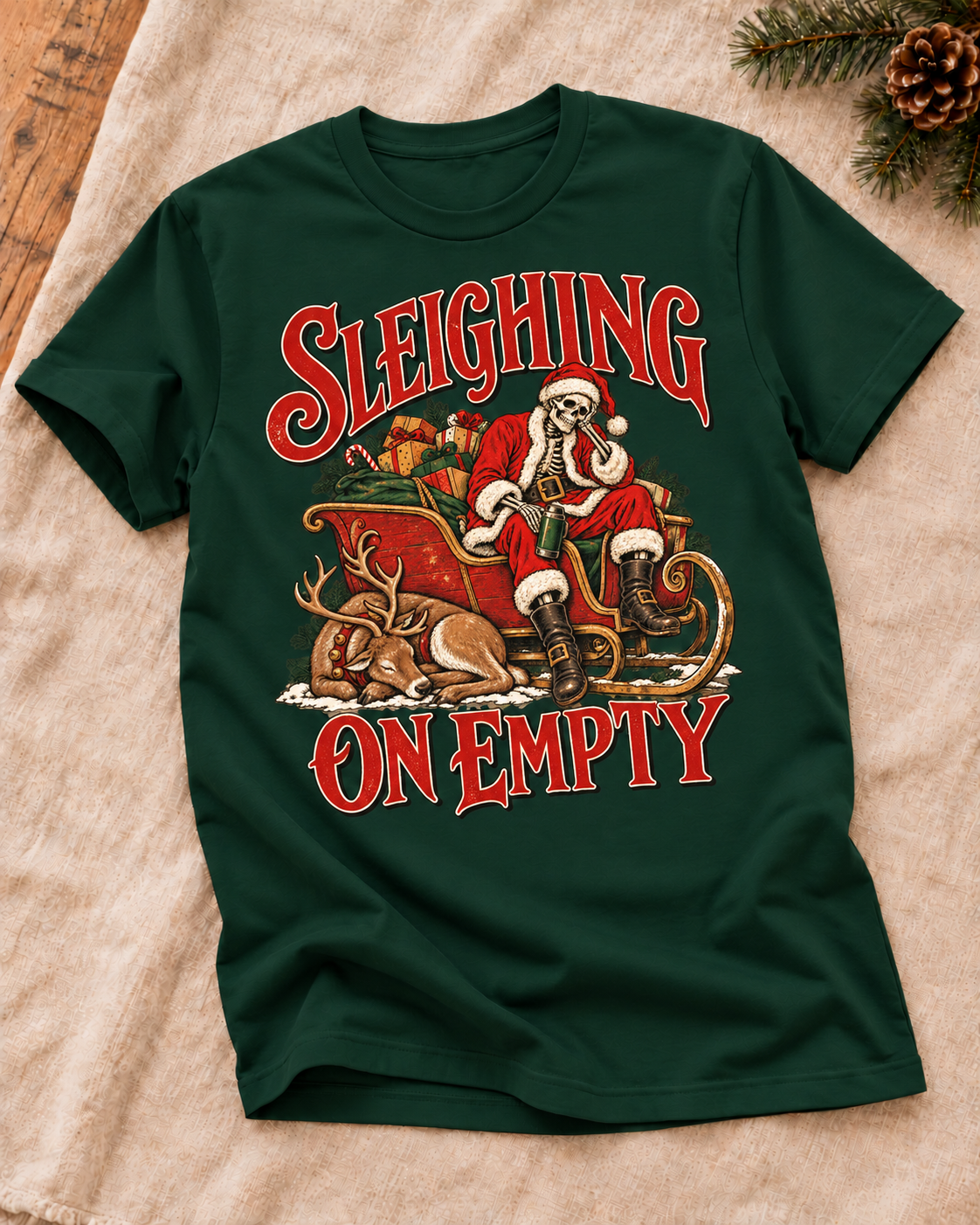 Generated styling preview: Sleighing on Empty design on a Forest Green T-shirt, styled on warm cream fabric