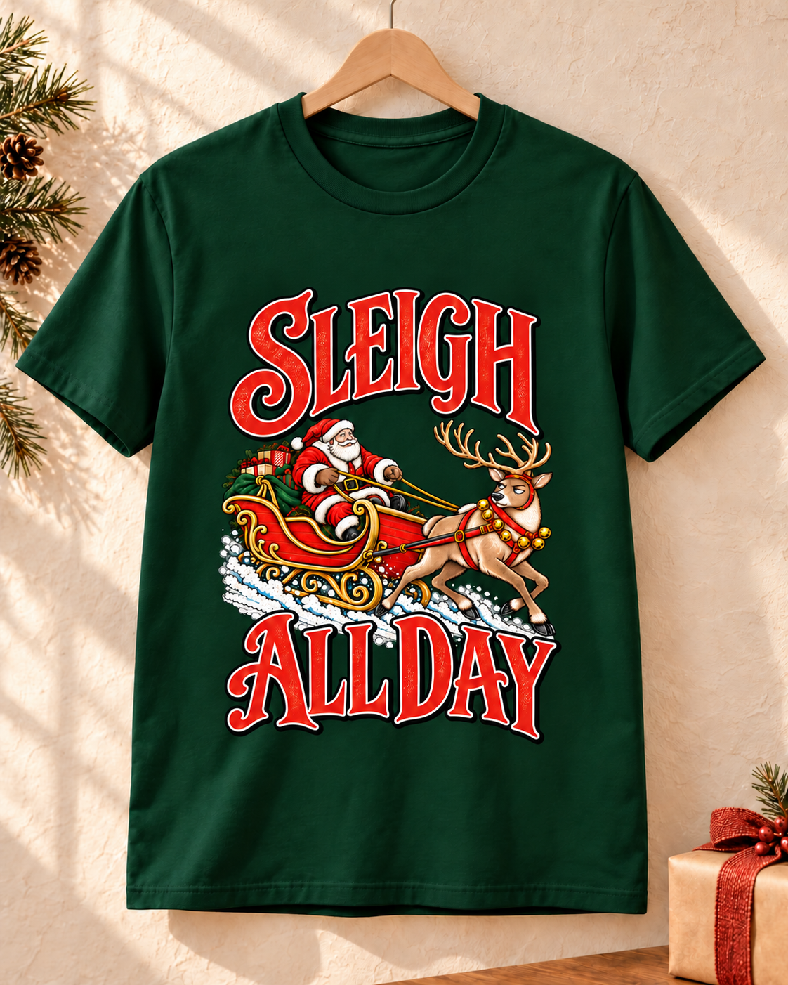 Sleigh All Day design on a Forest Green T-shirt, hanging in a warm festive setting