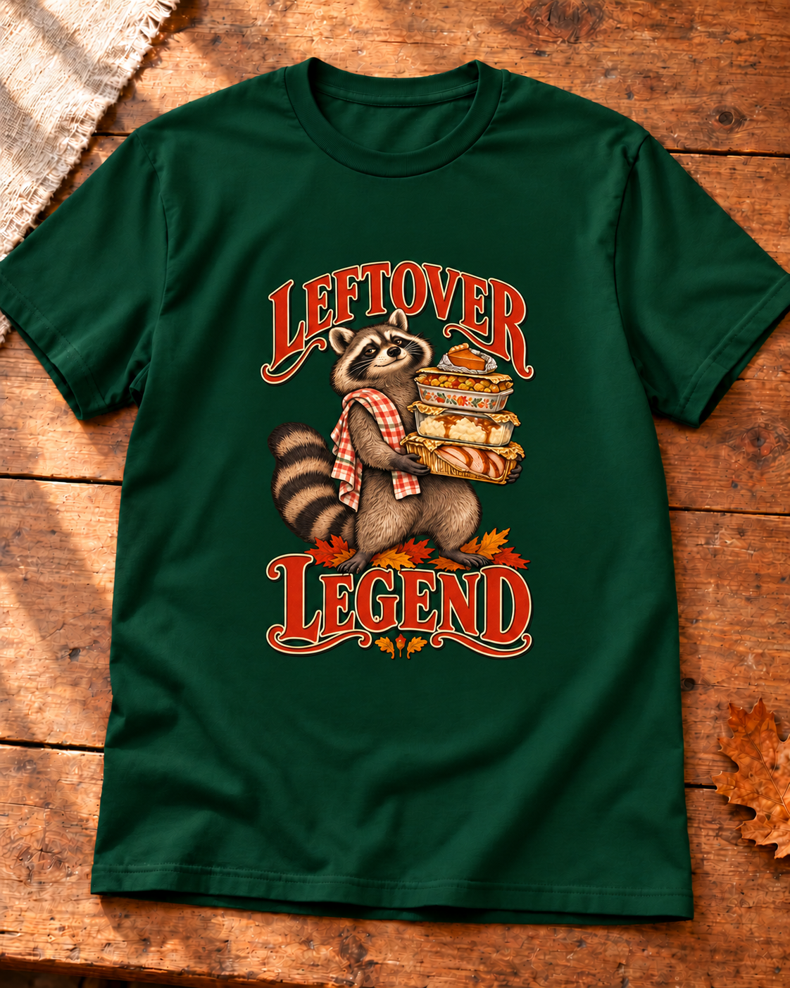 Leftover Legend design on a Forest Green T-shirt, styled on warm wood