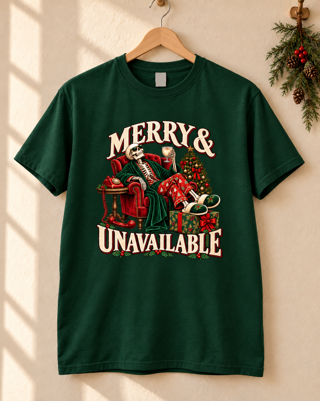 Merry and Unavailable design on a Forest Green T-shirt, hanging against a warm cream wall